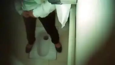 Indian airport employee sets era in restroom to film women